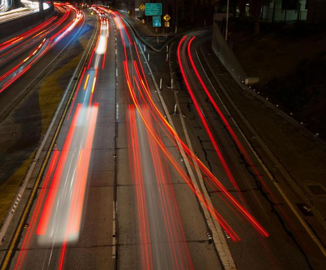 This four-second time-lapse photo of a Los Angeles freeway illustrates the complexities of decision-making, as one driver appears to have made a late change of mind while most drivers decided in advance whether to stay on the main road or take an exit ramp. Credit: Susanica Tam